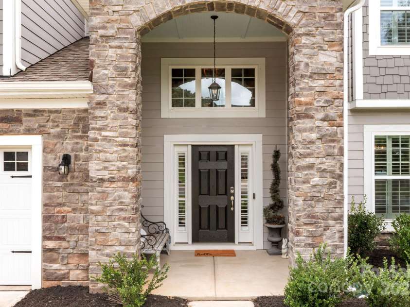 12710 Longford Crossing Place, Huntersville, NC 28078.  MLS# CAR4294654, YatesRealty ID 34868. Stone surrounds the inviting front porch