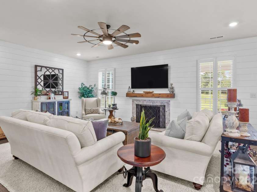 12710 Longford Crossing Place, Huntersville, NC 28078.  MLS# CAR4294654, YatesRealty ID 34868. Upgraded lighting & shiplap walls in the living room