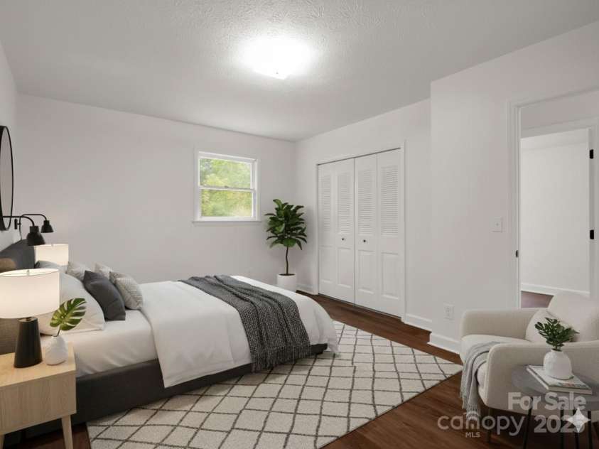 30 Patti Drive, Fletcher, NC 28732.  MLS# CAR4296193, YatesRealty ID 34869. Large primary bedroom w/ closet and attached bathroom. (Virtually Staged)