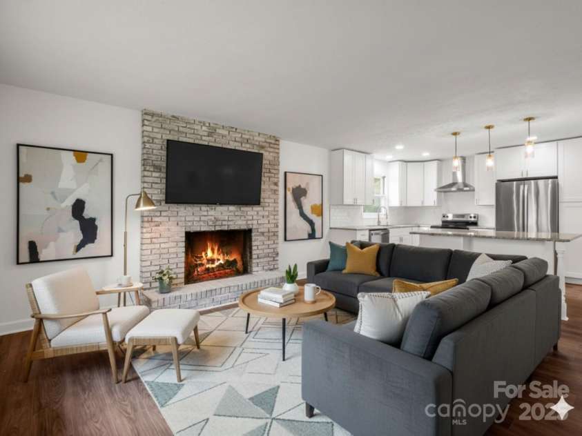 30 Patti Drive, Fletcher, NC 28732.  MLS# CAR4296193, YatesRealty ID 34869. Open concept living flows seamlessly from the living to kitchen, with beautiful wood burning fire place (Virtually Staged)