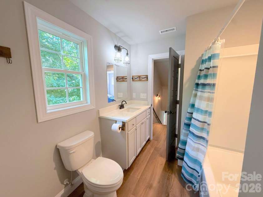 521 Johnson Street, Chester, SC 29706.  MLS# CAR4400310, YatesRealty ID 34869. Full Bathroom – Upstairs full bath with a modern vanity, updated fixtures, and a tub/shower combination for added convenience.