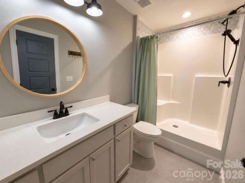 521 Johnson Street, Chester, SC 29706.  MLS# CAR4400310, YatesRealty ID 34869. Primary Bathroom – Bright en-suite bathroom offering a walk-in shower, contemporary finishes, and a clean, functional layout.