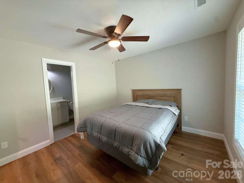 521 Johnson Street, Chester, SC 29706.  MLS# CAR4400310, YatesRealty ID 34869. Primary Bedroom – Comfortable primary suite with a ceiling fan, large window, and direct access to the en-suite bathroom.