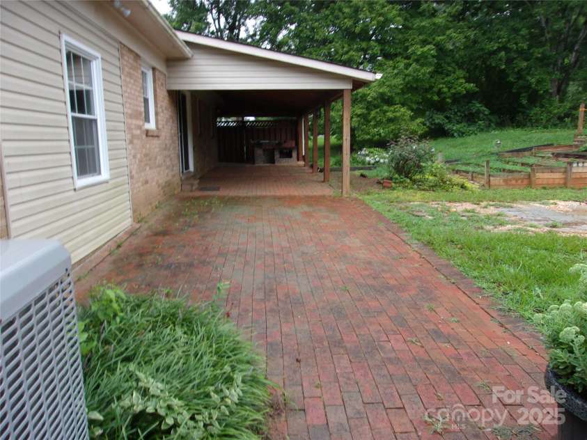 163 Whitney Lane, Statesville, NC 28625.  MLS# CAR4293598, YatesRealty ID 34870. Brick layed patio
