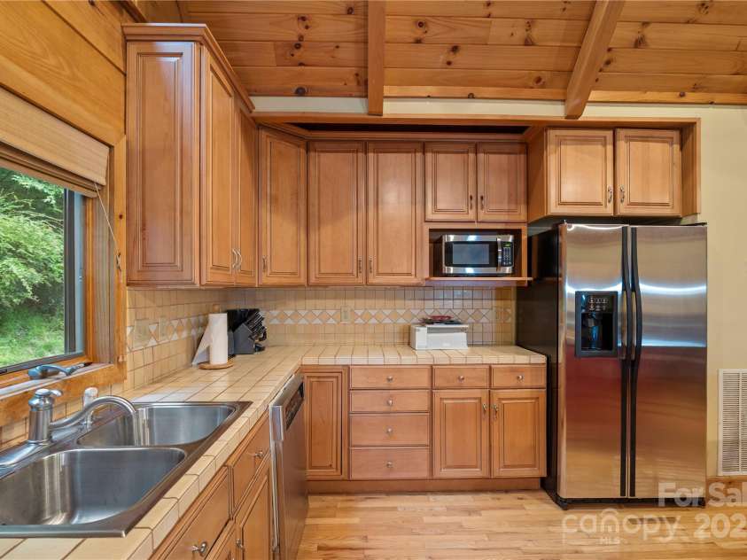 12215 Big Laurel Road, Marshall, NC 28753.  MLS# CAR4289922, YatesRealty ID 34872. Close up of kitchen, all appliances convey