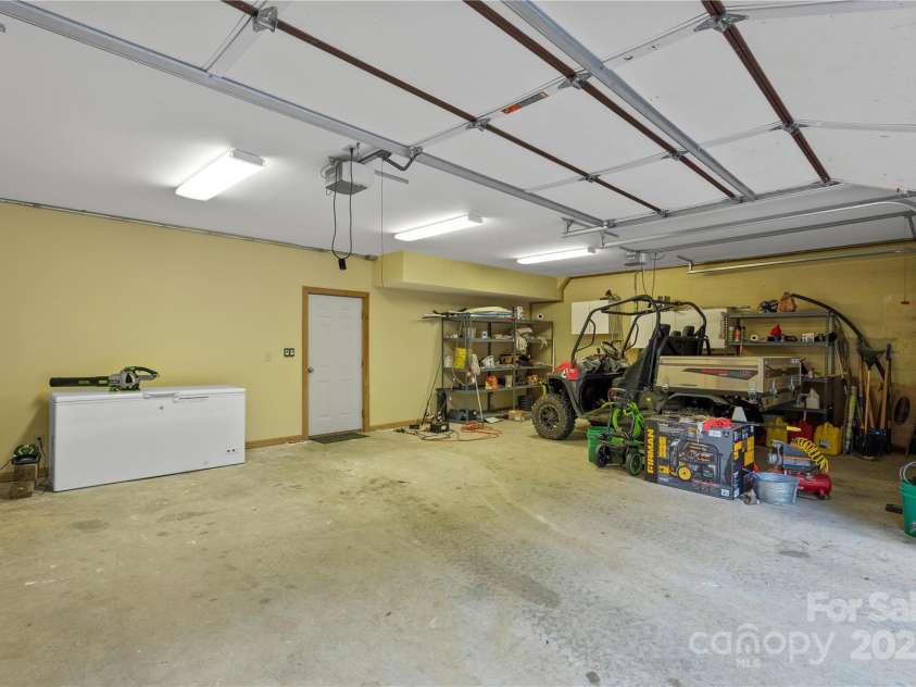 12215 Big Laurel Road, Marshall, NC 28753.  MLS# CAR4289922, YatesRealty ID 34872. Huge 3 car garage in basement for plenty of storage