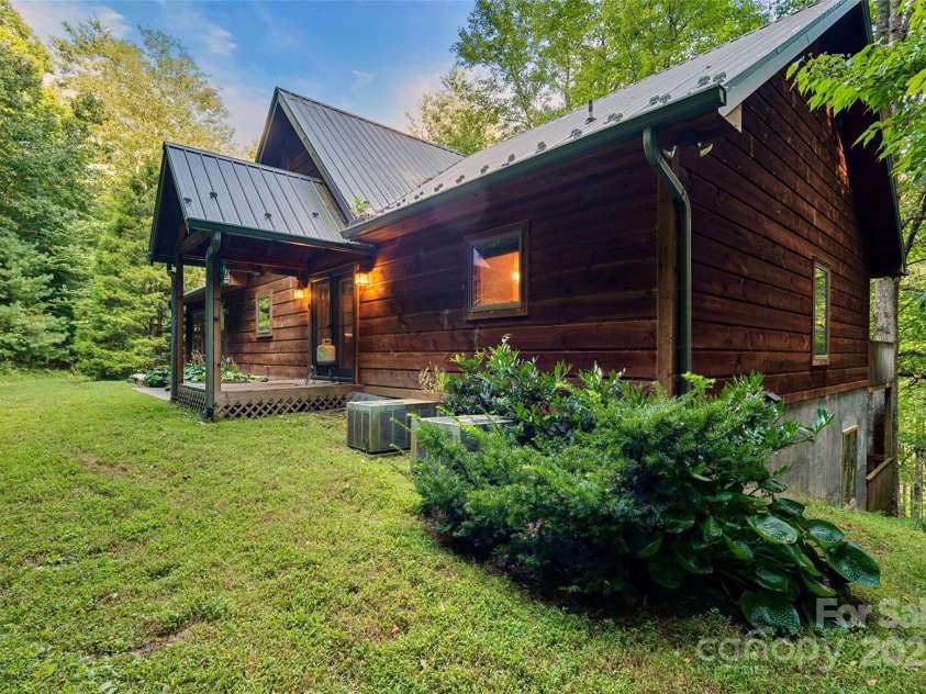 12215 Big Laurel Road, Marshall, NC 28753.  MLS# CAR4289922, YatesRealty ID 34872. Main home is a log home with metal roof