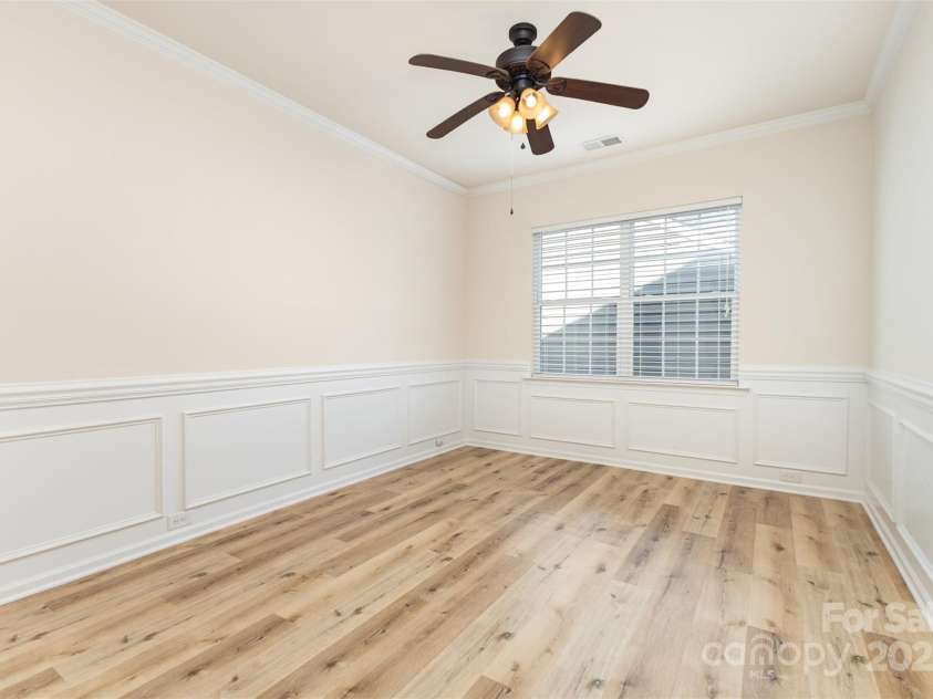 6007 Edinburgh Lane, Fort Mill, SC 29707.  MLS# CAR4295658, YatesRealty ID 34881. As you proceed down the hallway you'll find a flex room, formal DR, craft room, den.