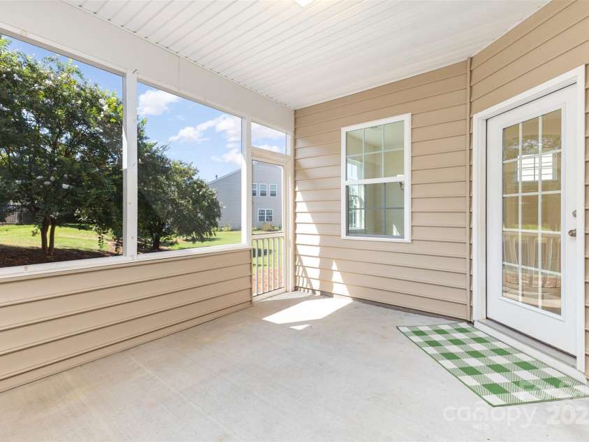 6007 Edinburgh Lane, Fort Mill, SC 29707.  MLS# CAR4295658, YatesRealty ID 34881. Enjoy the fresh air in your enclosed porch.