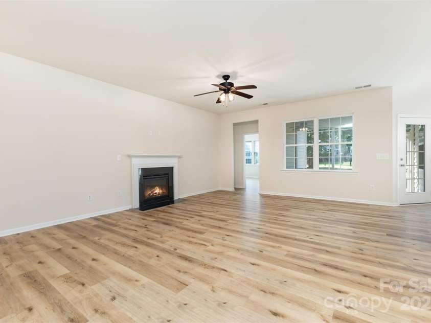 6007 Edinburgh Lane, Fort Mill, SC 29707.  MLS# CAR4295658, YatesRealty ID 34881. Family Room with entryway to primary bedroom