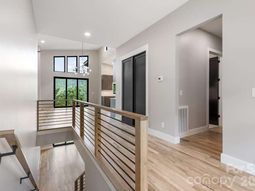 60 King Horn Ridge, Waynesville, NC 28785.  MLS# CAR4389004, YatesRealty ID 34887. Entry, stairs and view through common area.