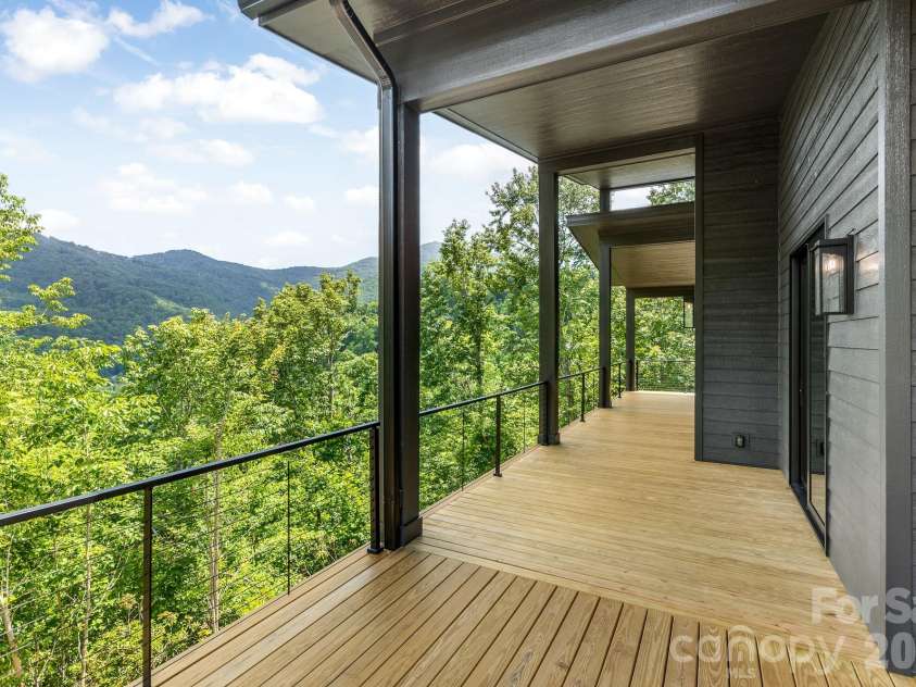 60 King Horn Ridge, Waynesville, NC 28785.  MLS# CAR4389004, YatesRealty ID 34887. Main level rear deck & porch.
