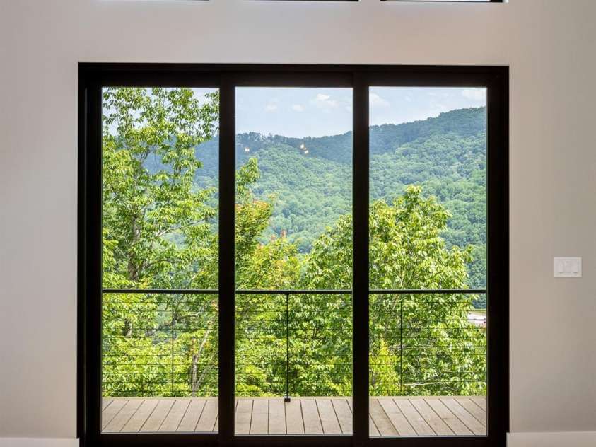 60 King Horn Ridge, Waynesville, NC 28785.  MLS# CAR4389004, YatesRealty ID 34887. View through telescoping sliders.