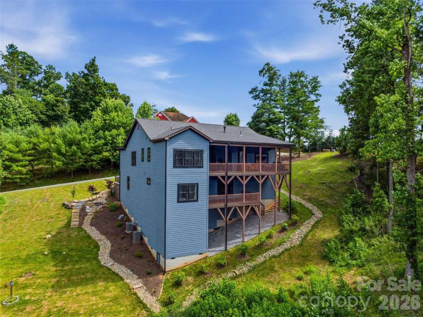 11 Timber Hill Drive, Leicester, NC 28748.  MLS# CAR4395563, YatesRealty ID 34902. Built to enjoy the landscape, this home combines stunning views with functionality.