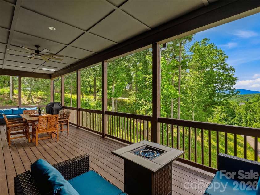 11 Timber Hill Drive, Leicester, NC 28748.  MLS# CAR4395563, YatesRealty ID 34902. Enjoy sunset views from the covered deck.