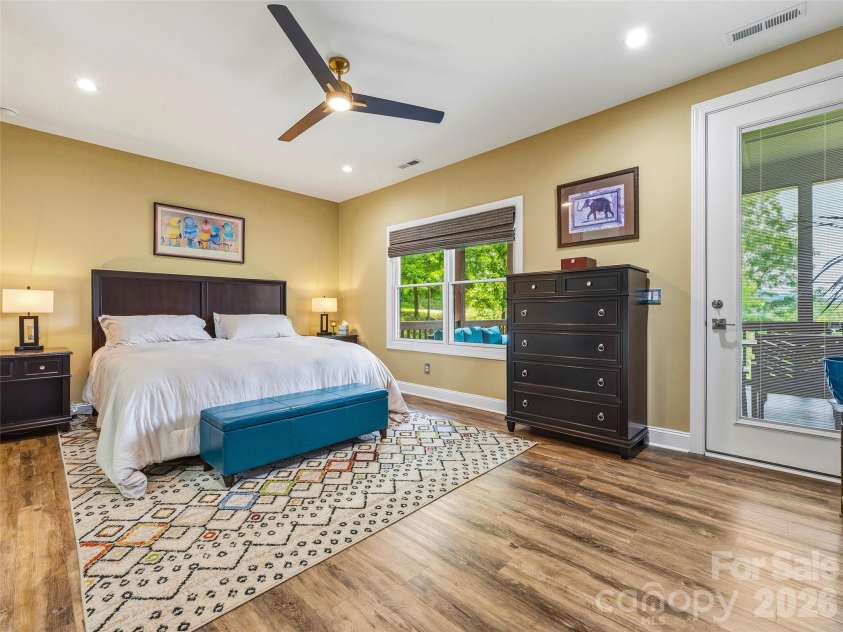 11 Timber Hill Drive, Leicester, NC 28748.  MLS# CAR4395563, YatesRealty ID 34902. The primary retreat features access to the deck.