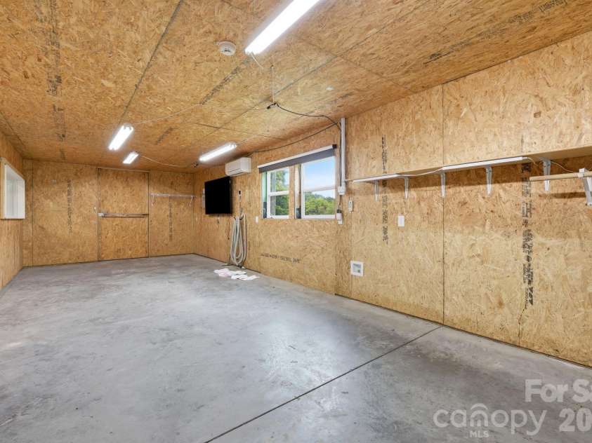41 Bell Sprinkle Road, Weaverville, NC 28787.  MLS# CAR4391644, YatesRealty ID 34903. Office room in detached workshop garage