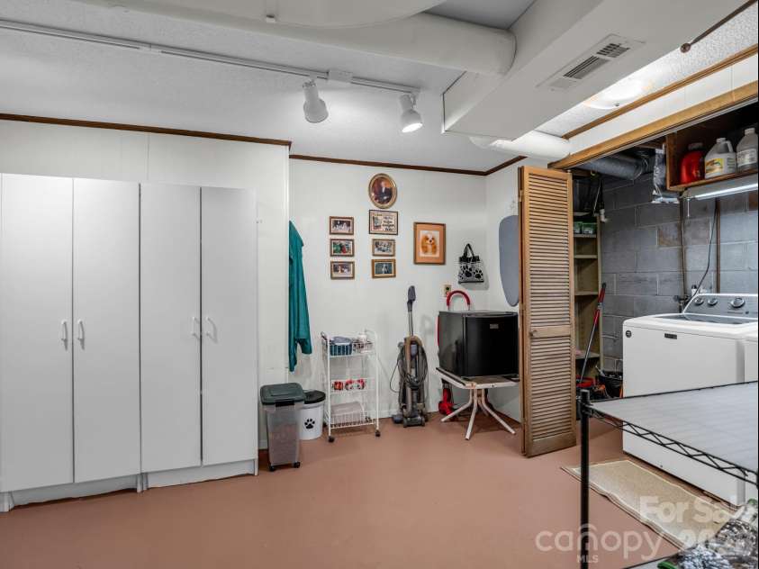 390 Mountain Laurel Drive, Columbus, NC 28722.  MLS# CAR4399139, YatesRealty ID 34904. Basement laundry area