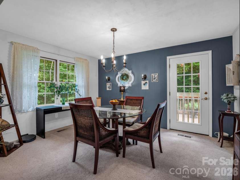 390 Mountain Laurel Drive, Columbus, NC 28722.  MLS# CAR4399139, YatesRealty ID 34904. Dining area opens to the deck