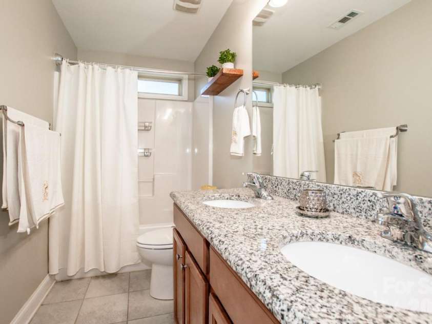 130 Eagles Landing Drive, Mooresville, NC 28117.  MLS# CAR4407110, YatesRealty ID 34907. Hall bathroom with dual vanities