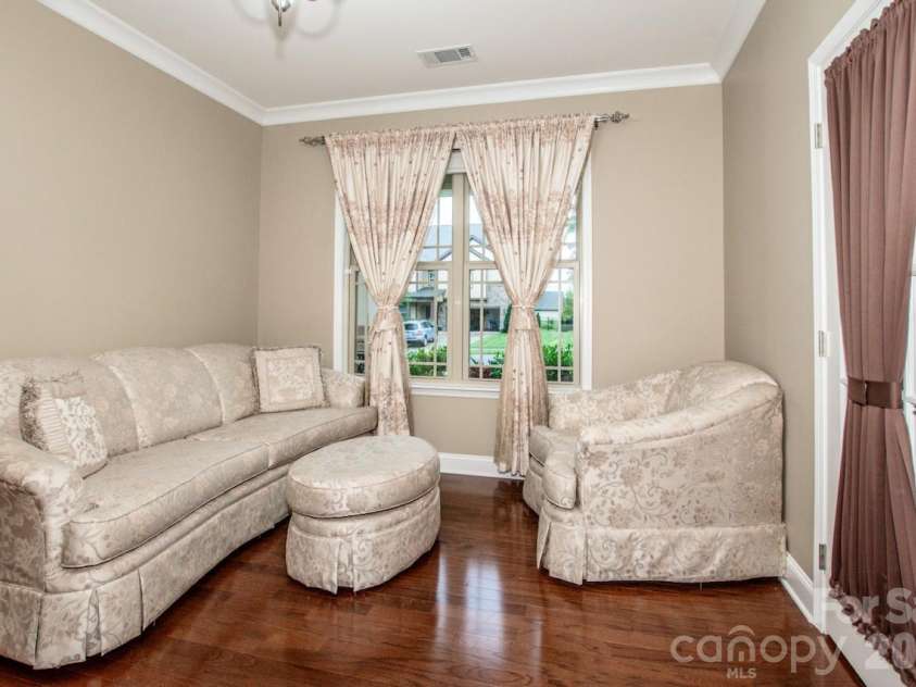 130 Eagles Landing Drive, Mooresville, NC 28117.  MLS# CAR4407110, YatesRealty ID 34907. Office has rooms for multiple desks plus a seating area!
