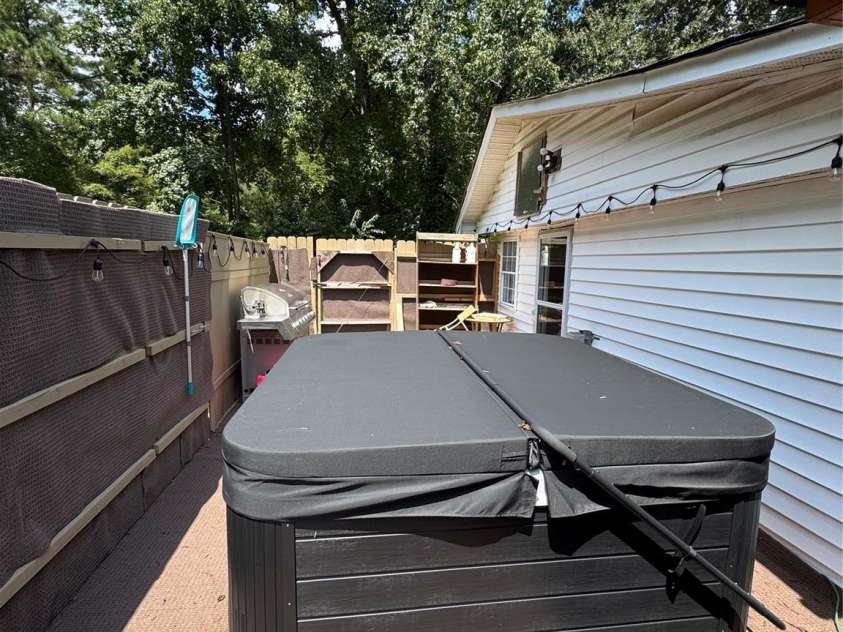 816 Skyland Drive, Kannapolis, NC 28124.  MLS# CAR4296768, YatesRealty ID 34908. Private rear porch with hot tub and sauna