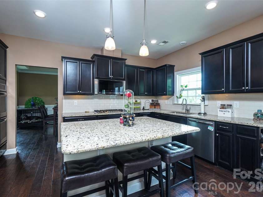 1238 Stonecrest Boulevard, Fort Mill, SC 29708.  MLS# CAR4394779, YatesRealty ID 34912. Granite Kitchen Island