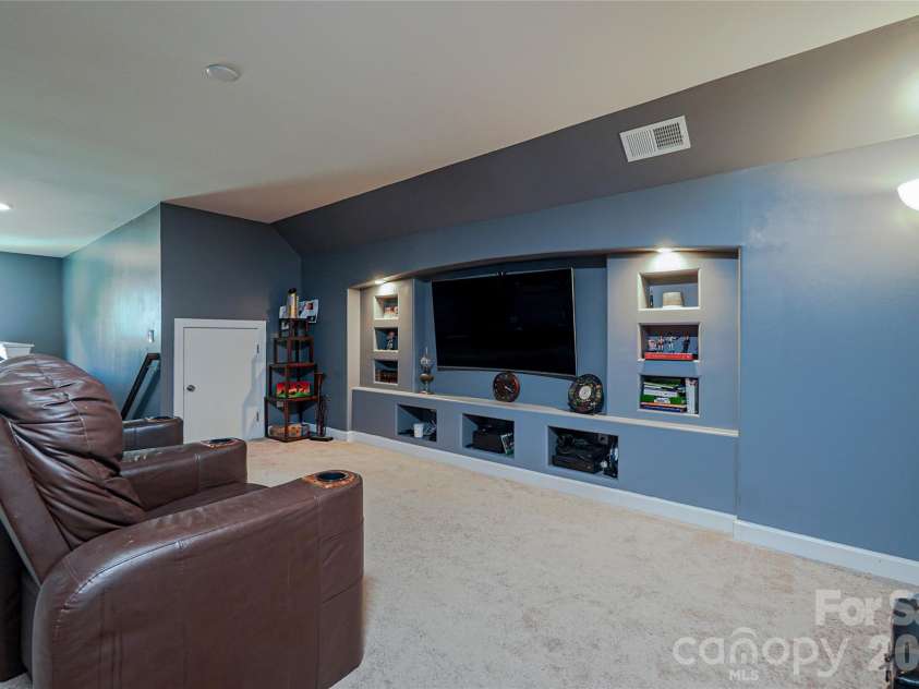1238 Stonecrest Boulevard, Fort Mill, SC 29708.  MLS# CAR4394779, YatesRealty ID 34912. TV screening room