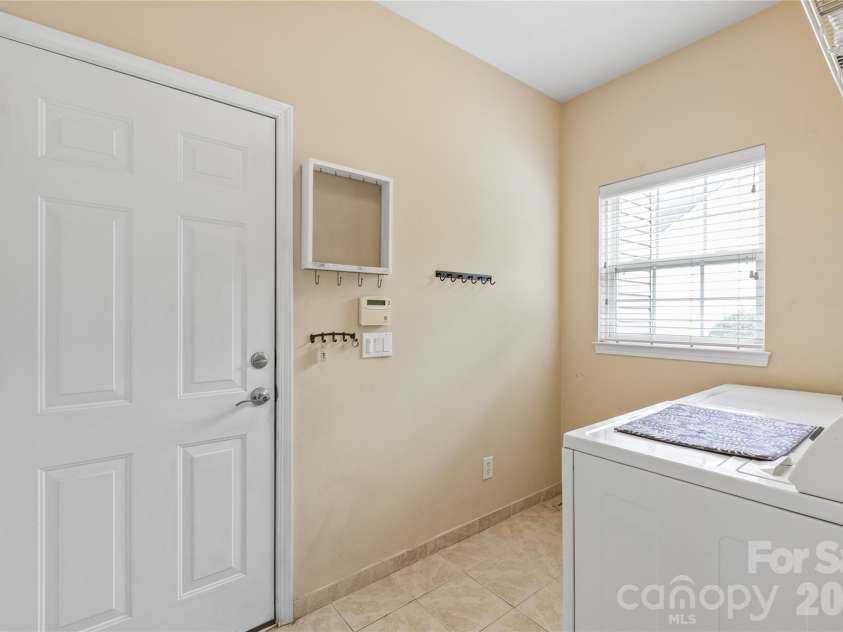 11786 Crossroads Place, Concord, NC 28025.  MLS# CAR4396437, YatesRealty ID 34919. Laundry Room