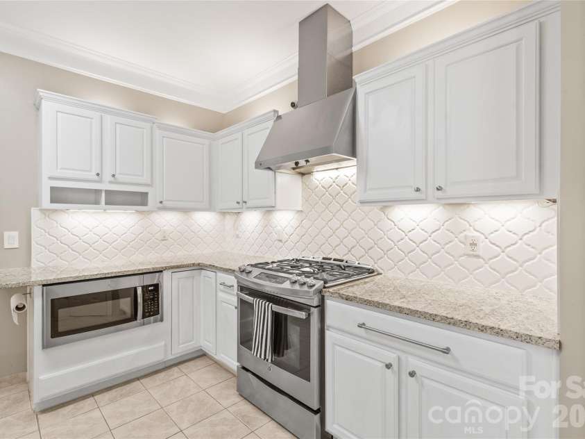11786 Crossroads Place, Concord, NC 28025.  MLS# CAR4396437, YatesRealty ID 34919. Stunning Granite Countertops, Custom Backsplash and Gas Range