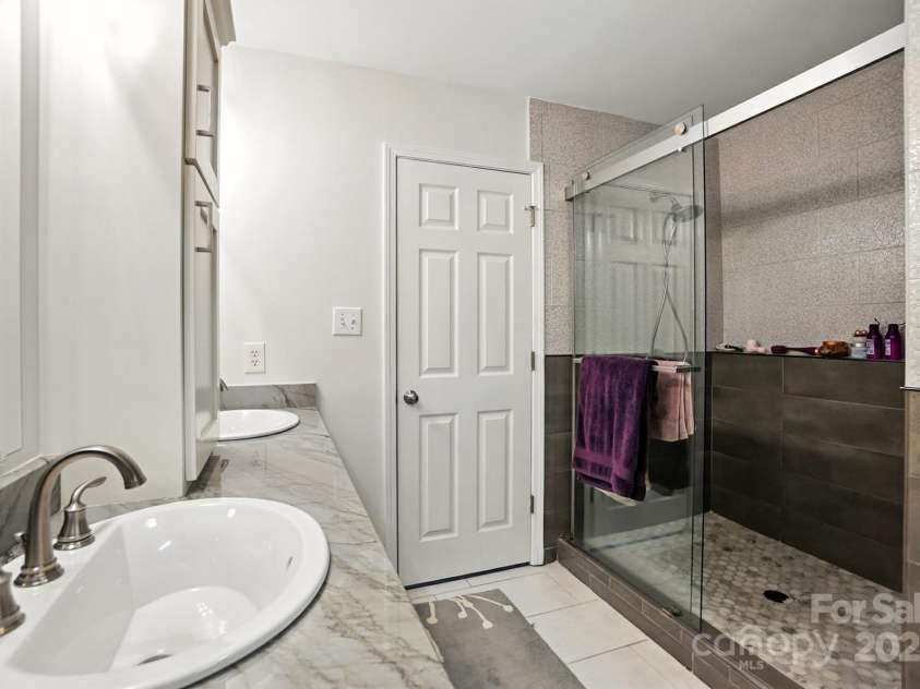 6523 Point Comfort Lane, Charlotte, NC 28226.  MLS# CAR4297368, YatesRealty ID 34920. Exquisite huge Primary Shower renovation