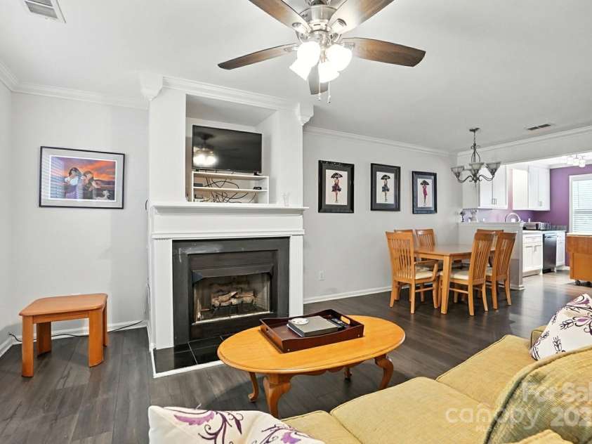 6523 Point Comfort Lane, Charlotte, NC 28226.  MLS# CAR4297368, YatesRealty ID 34920. Stunning luxury vinyl floors throughout with gas log fireplace