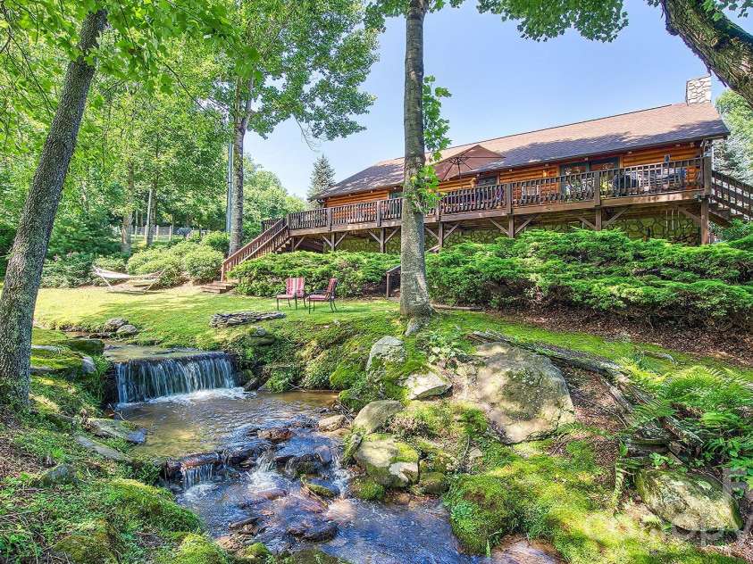 41 Nanny Patch Cove, Maggie Valley, NC 28751.  MLS# CAR4391200, YatesRealty ID 34927. Backyard creekside