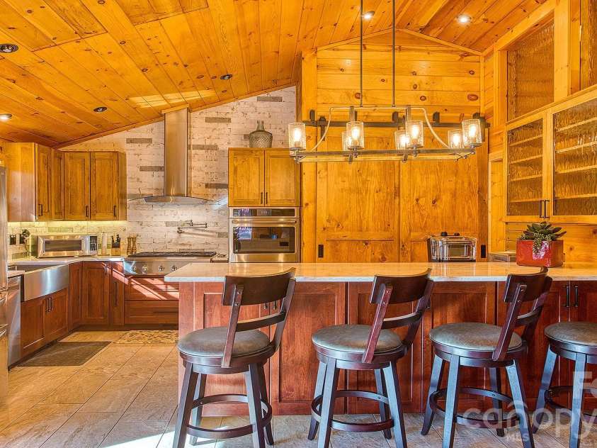 41 Nanny Patch Cove, Maggie Valley, NC 28751.  MLS# CAR4391200, YatesRealty ID 34927. Dining room looking towards kitchen
