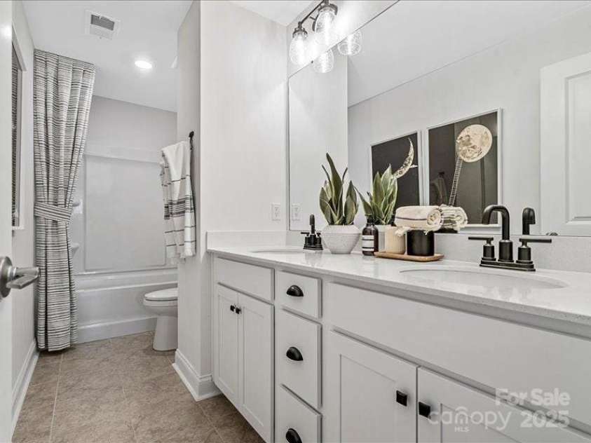 136 Ella Claire Drive, York, SC 29745.  MLS# CAR4187874, YatesRealty ID 3493. PHOTO REPRESENTATION ONLY. Secondary full bathroom of decorated model home. Finishes are different than shown. Refer to interior design selections for finishes.