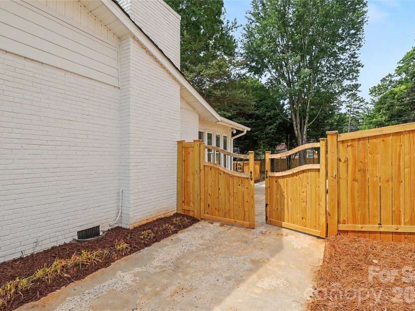 3834 Moultrie Street, Charlotte, NC 28209.  MLS# CAR4398282, YatesRealty ID 34938. Custom gate installed