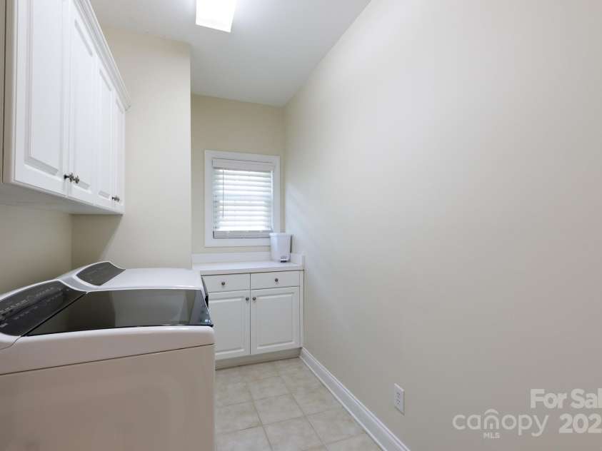 905 Patricians Lane, Monroe, NC 28110.  MLS# CAR4255344, YatesRealty ID 34938. Spacious laundry room w/ sink at garage entrance!