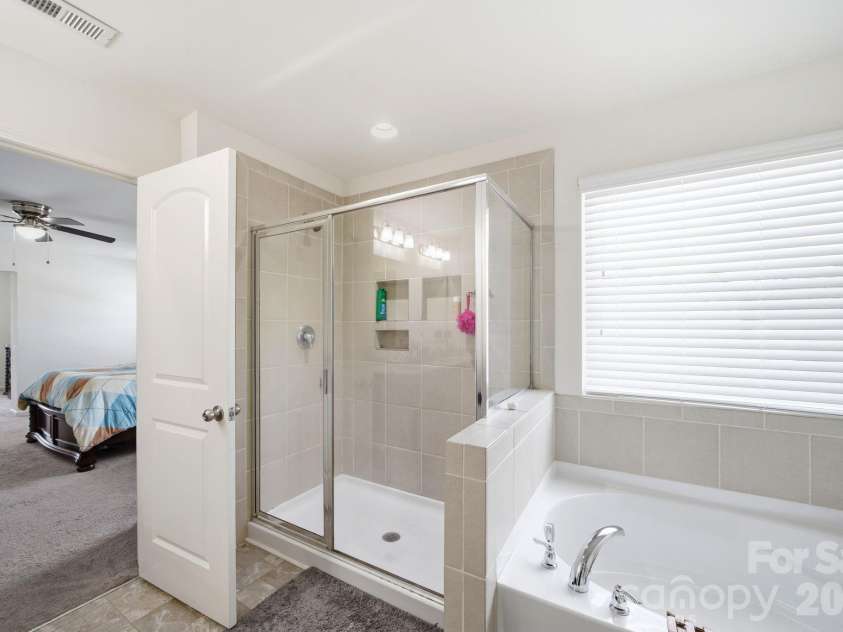 1249 Ettrick Avenue, Rock Hill, SC 29732.  MLS# CAR4378244, YatesRealty ID 34942. Spacious Primary shower and soaking tub!