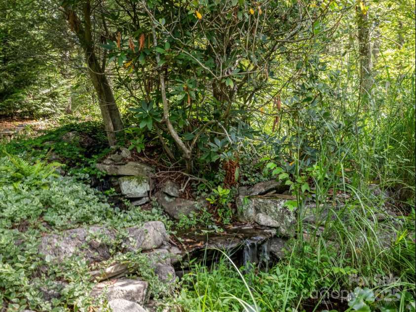 194 Bear Creek Drive, Fletcher, NC 28732.  MLS# CAR4287026, YatesRealty ID 34943. Cue the sound effects. Just off the porch is the 