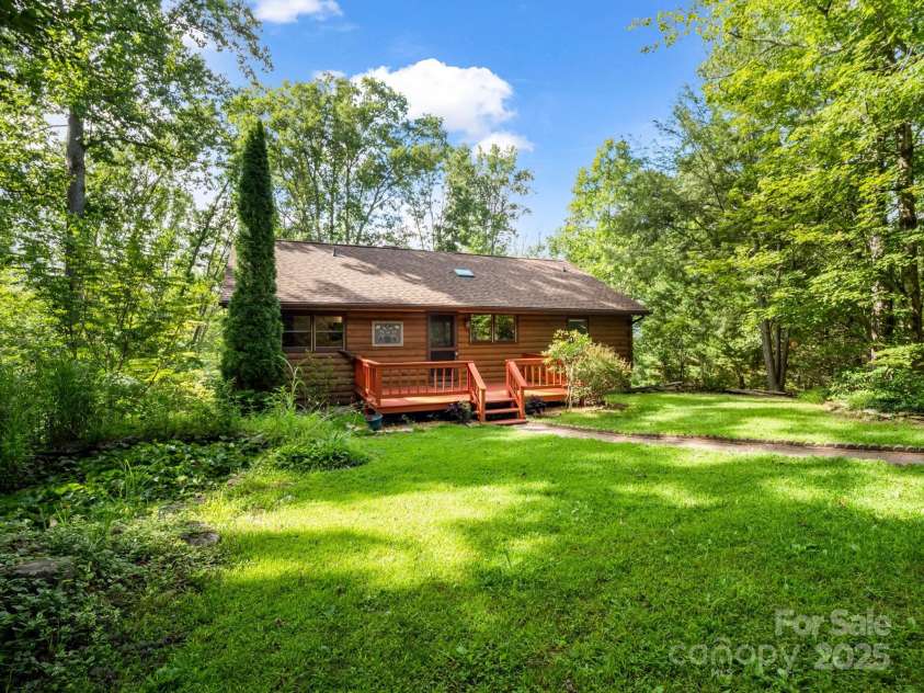 194 Bear Creek Drive, Fletcher, NC 28732.  MLS# CAR4287026, YatesRealty ID 34943. This log home is located on a quiet Fletcher street  - great neighbors and no HOA.