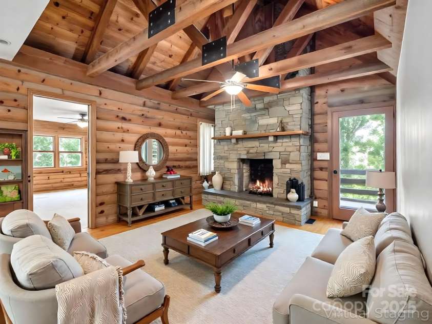 194 Bear Creek Drive, Fletcher, NC 28732.  MLS# CAR4287026, YatesRealty ID 34943. Virtually staged - this living room features exposed beams & a stone gas log fireplace.