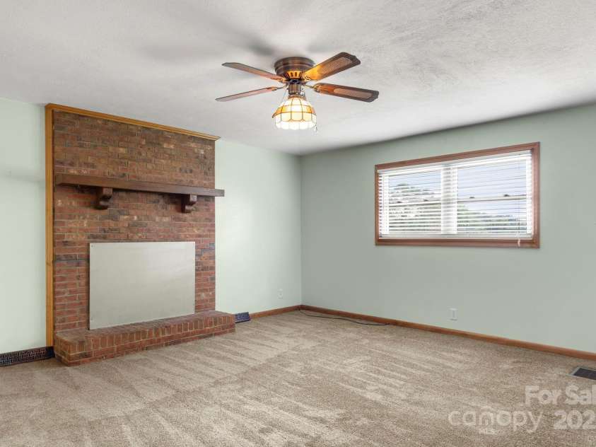 3110 Zion Church Road, Shelby, NC 28150.  MLS# CAR4291685, YatesRealty ID 34945. Large den with brick fireplace