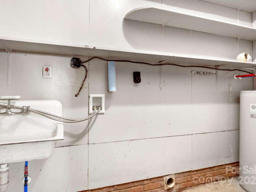 3110 Zion Church Road, Shelby, NC 28150.  MLS# CAR4291685, YatesRealty ID 34945. Laundry room is inside but does not count toward HLA.  It has a great work sink and tons of storage!