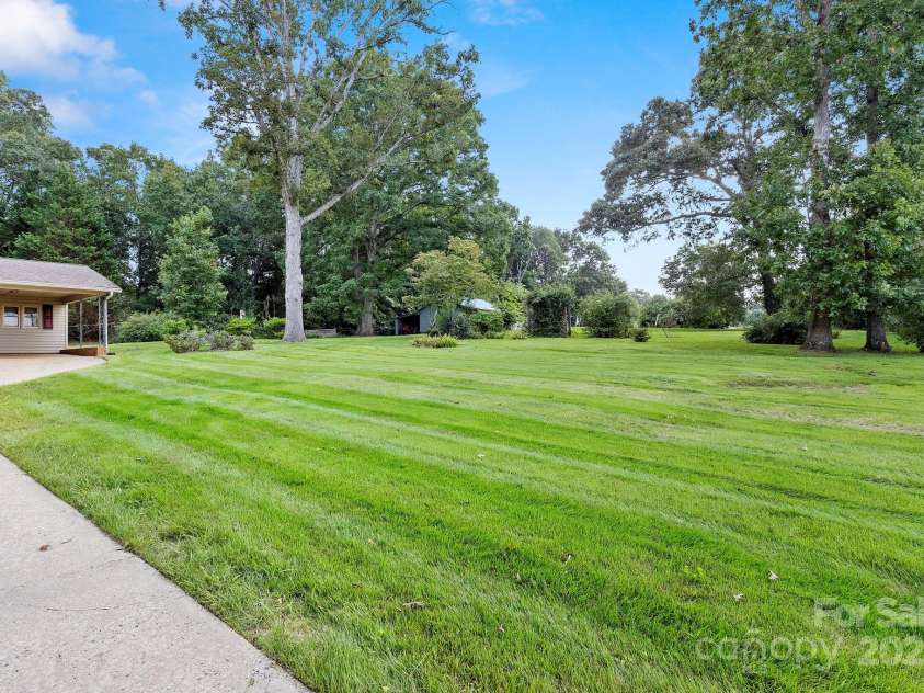3110 Zion Church Road, Shelby, NC 28150.  MLS# CAR4291685, YatesRealty ID 34945. More of the spacious acreage. There is a barn to the side of the house.