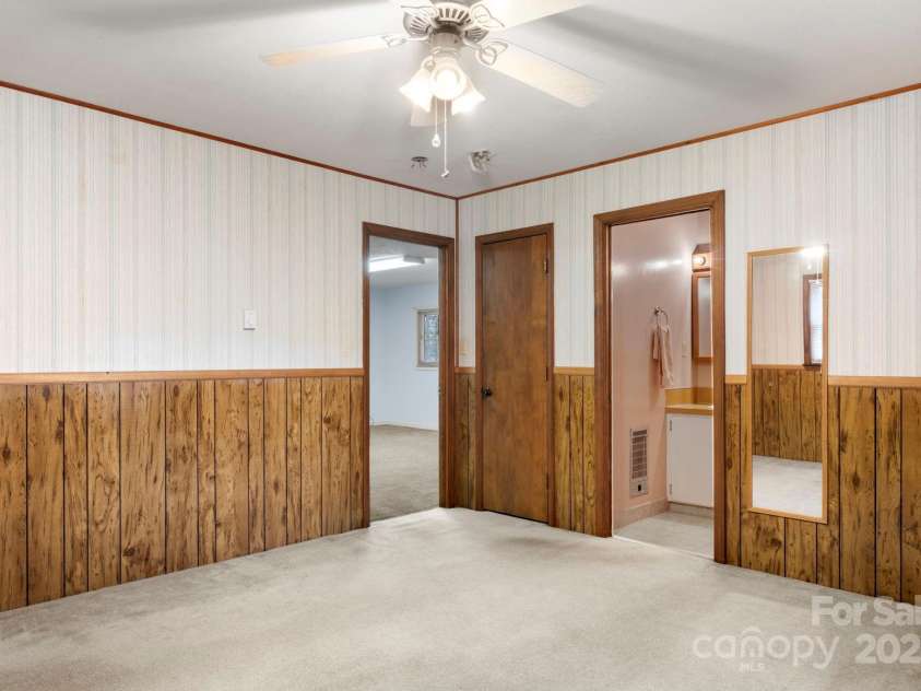 3110 Zion Church Road, Shelby, NC 28150.  MLS# CAR4291685, YatesRealty ID 34945. Primary bedroom view toward bathroom and bonus room