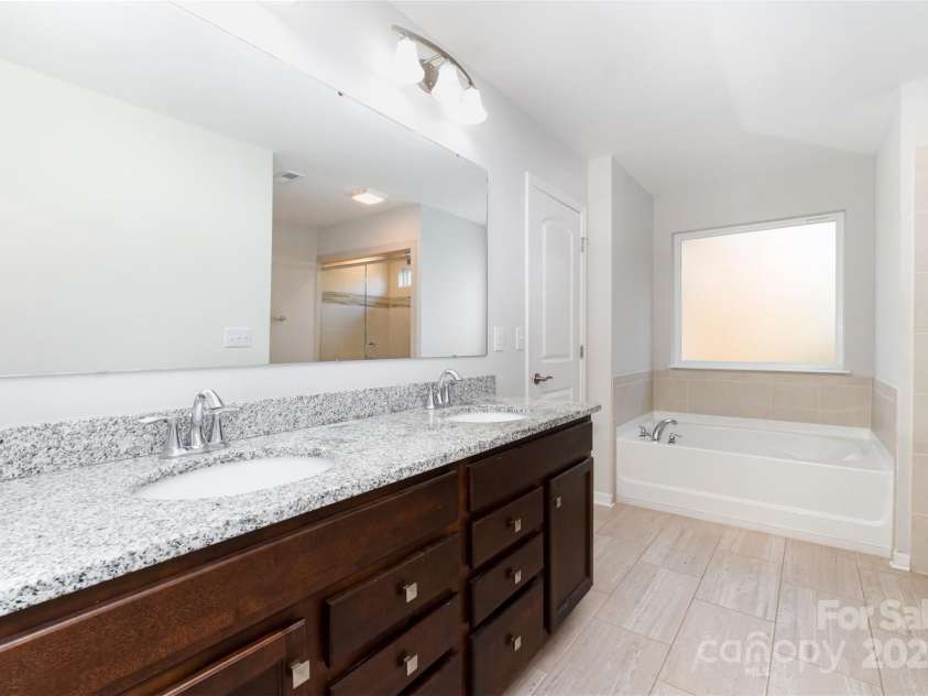 423 Crisfield Court, York, SC 29745.  MLS# CAR4319064, YatesRealty ID 34951. Garden tub and walk-in rain shower with frameless glass door