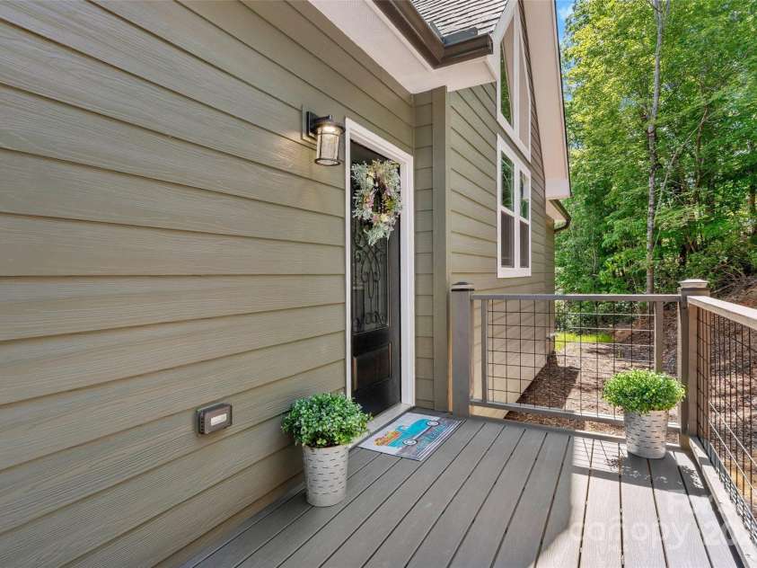 23 Laurel Crest Lane, Mill Spring, NC 28756.  MLS# CAR4294698, YatesRealty ID 34956. Front deck leading to front door