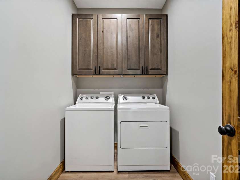 23 Laurel Crest Lane, Mill Spring, NC 28756.  MLS# CAR4294698, YatesRealty ID 34956. Laundry room on main level