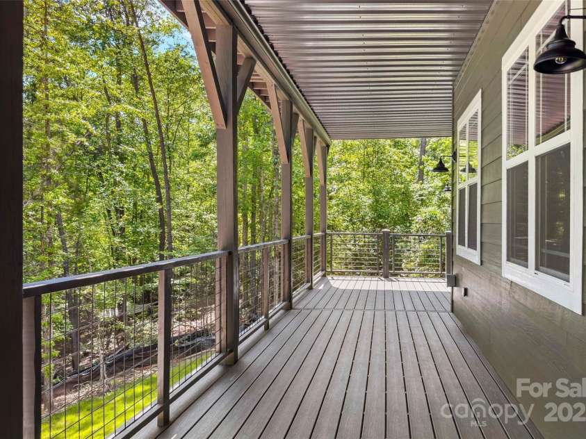 23 Laurel Crest Lane, Mill Spring, NC 28756.  MLS# CAR4294698, YatesRealty ID 34956. Lower level covered patio
