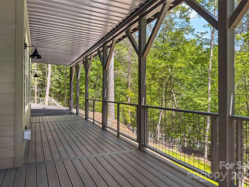 23 Laurel Crest Lane, Mill Spring, NC 28756.  MLS# CAR4294698, YatesRealty ID 34956. Lower level covered patio